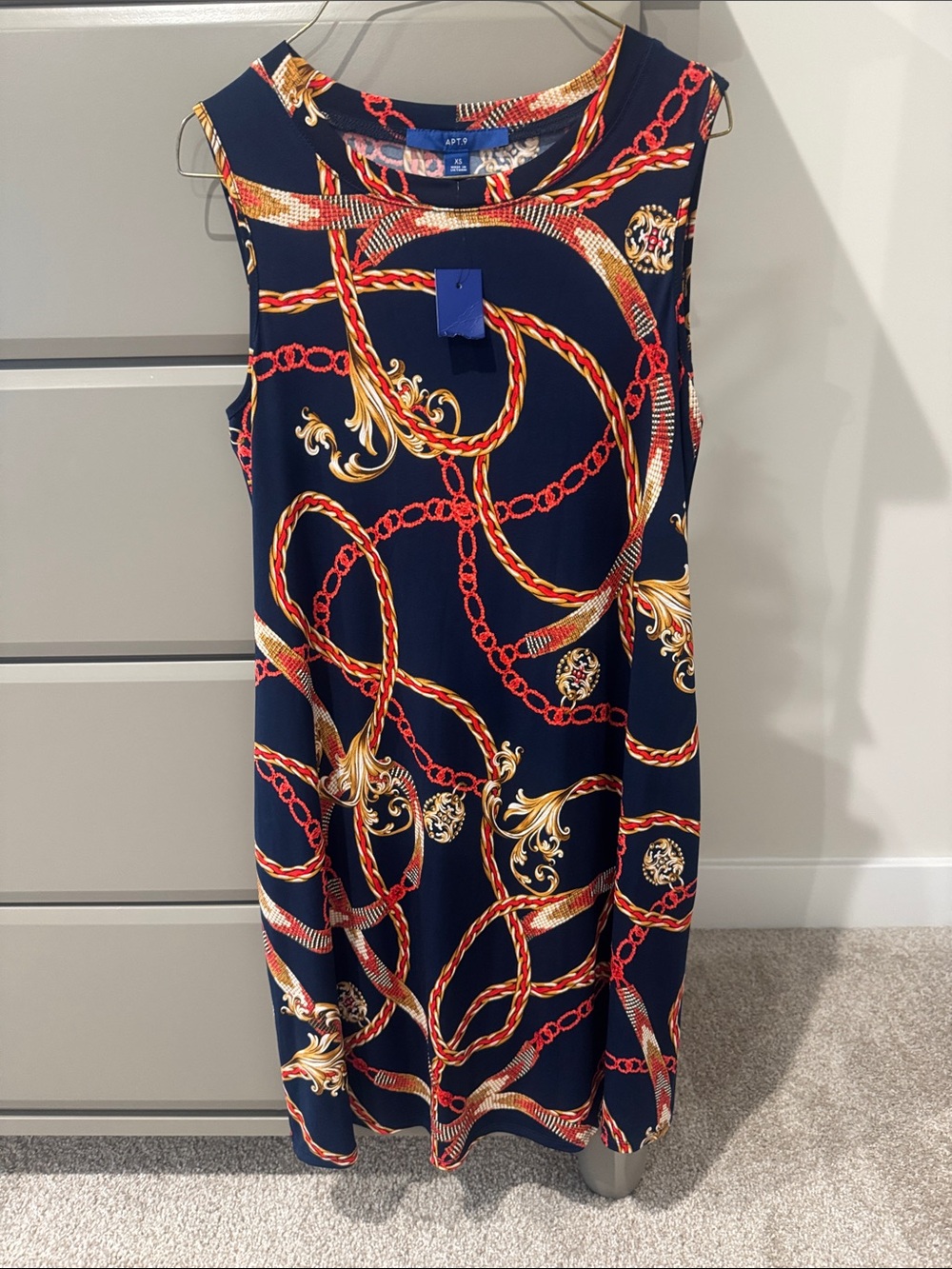 Navy dress with red and gold detail